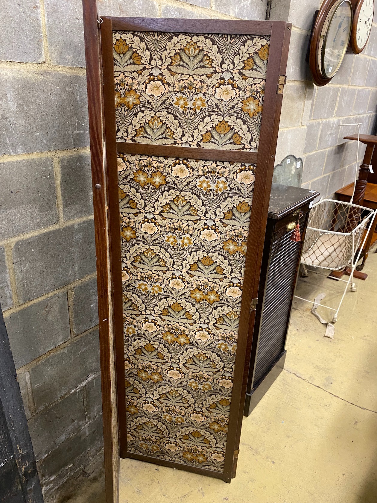 An oak four fold dressing screen with Morris style fabric panels, each panel width 50cm, height 174cm